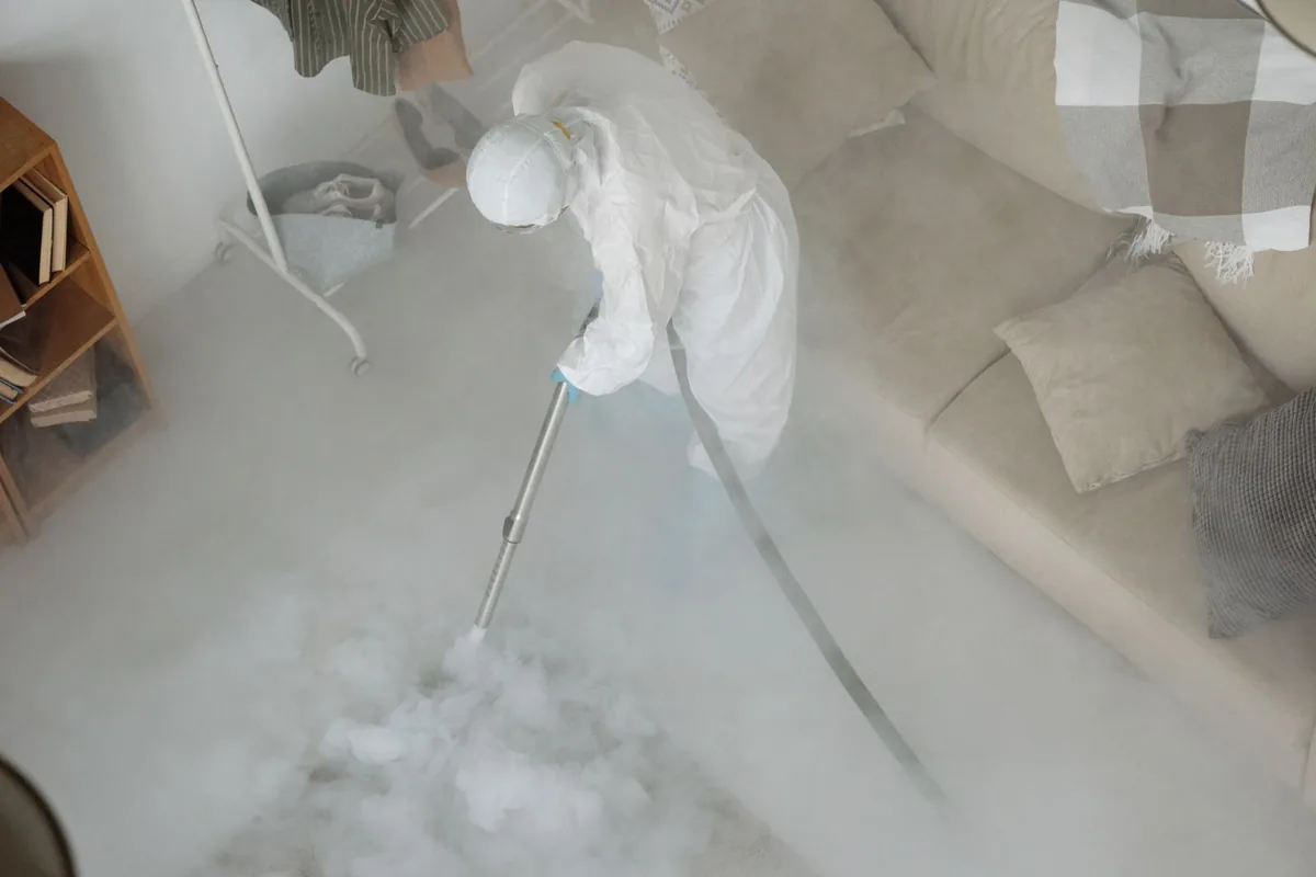 Biohazard cleanup technician in protective equipment, Buckhead Forest, Atlanta, GA